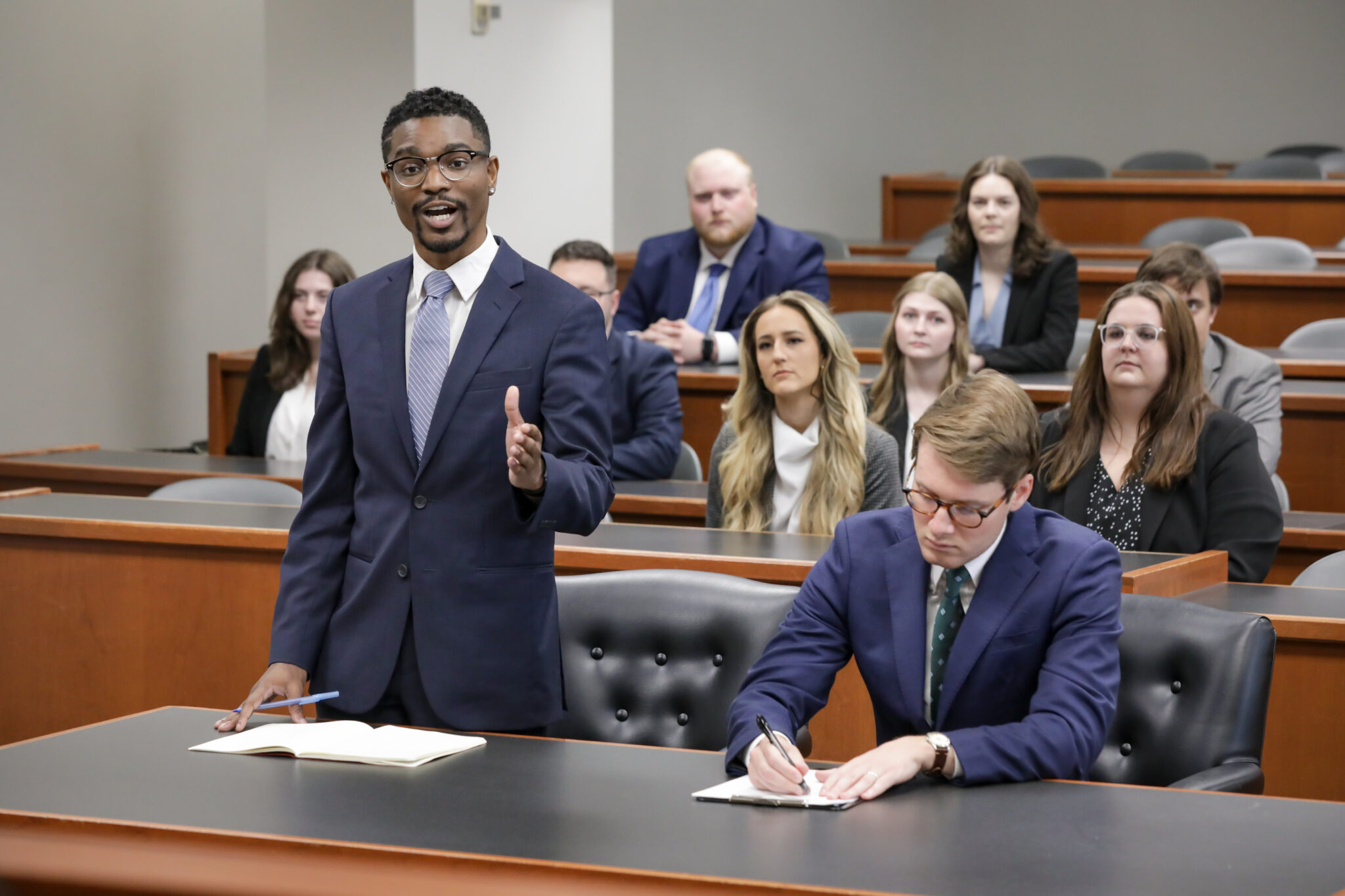 Students participating in a mock trial argument