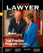Magazine cover of student and professor in a mock courtroom