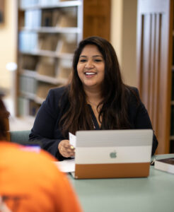 Shreya Shah smiling in the library