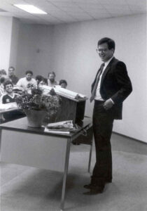 Archival photo of Mike Sabbath teaching in a classroom