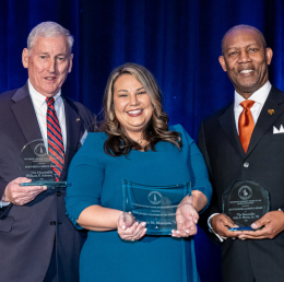 Sqaure image of three people holding awards