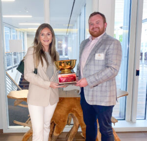 Michaela Manley and Jack Wareham holding the Legal Food Frenzy trophy