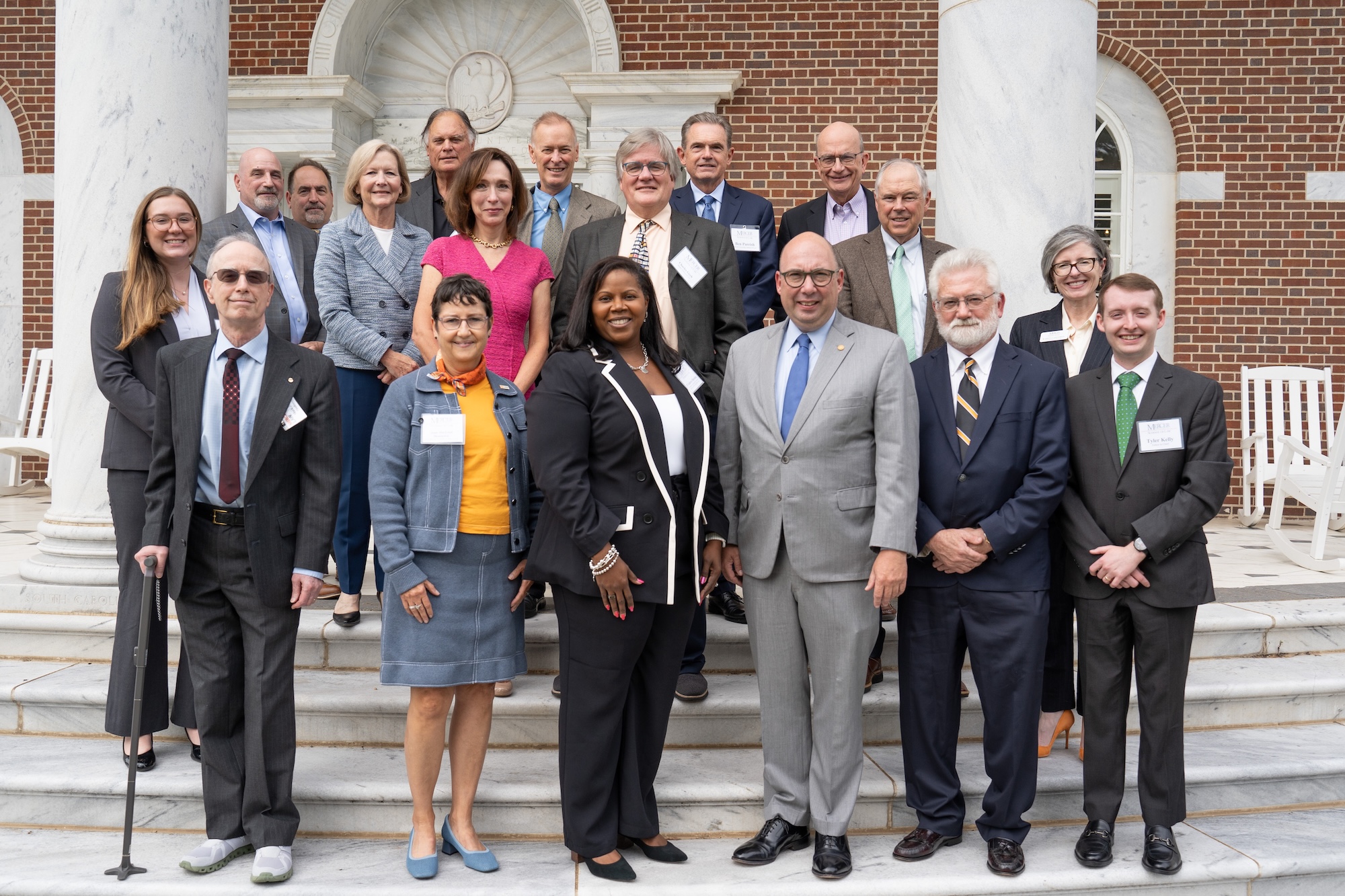 Group picture of Law Review Symposium speakers and coordinators on the front porch of Mercer Law School