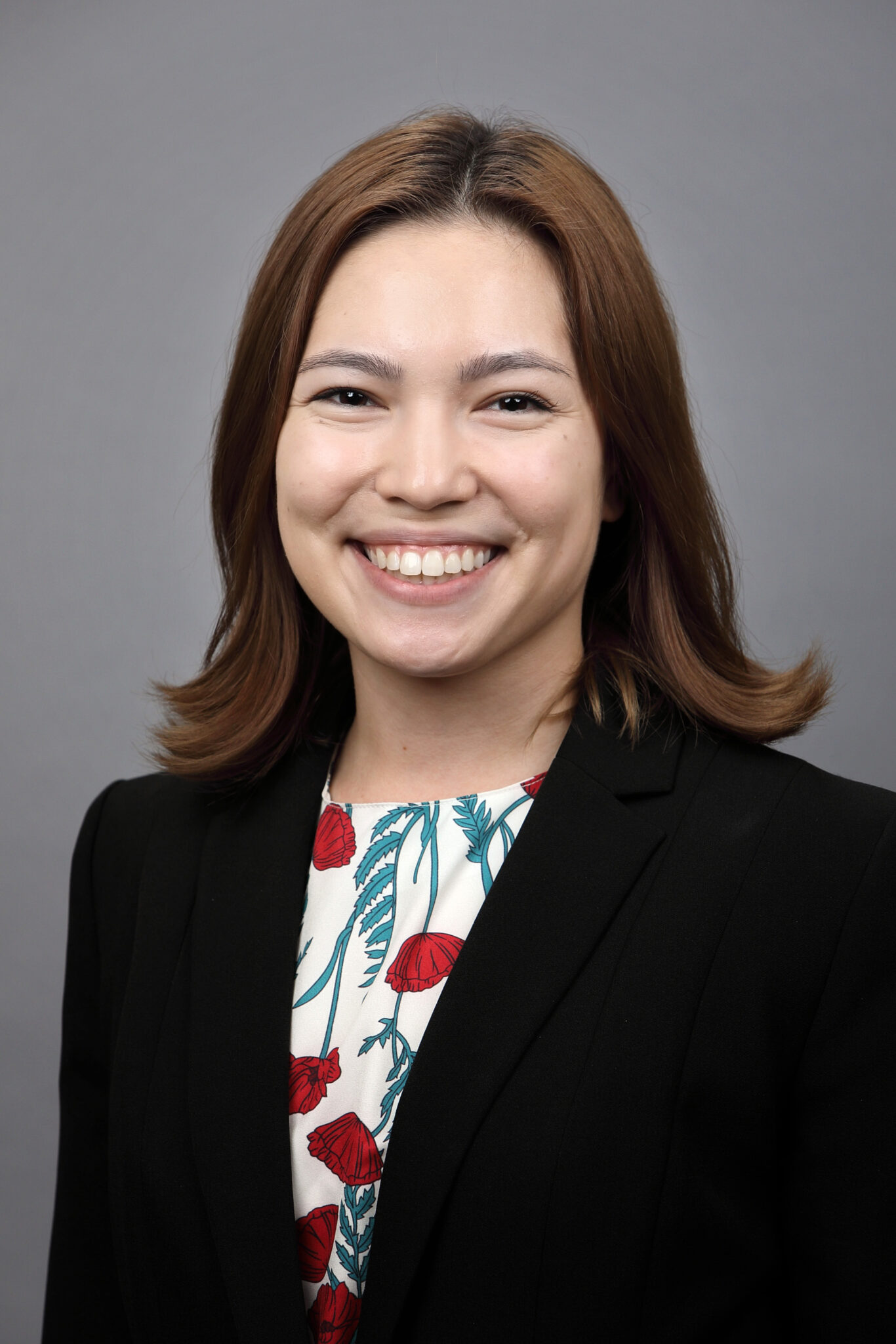 Headshot of Charlotte Meyer in front of a grey background