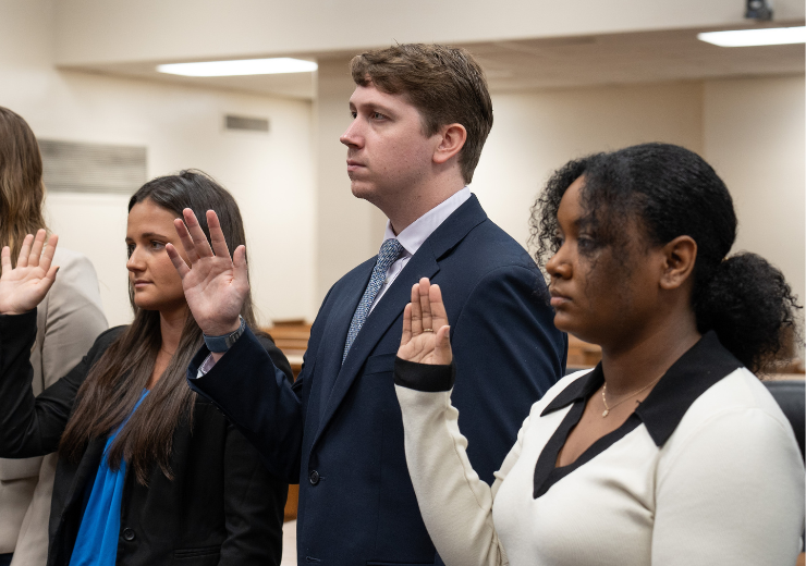 Image of students being sworn in through the Student Practice Act