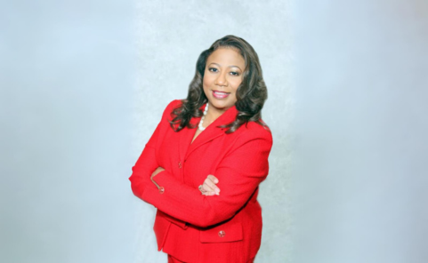 Image of Judge Miller in a red suit in front of a gray background