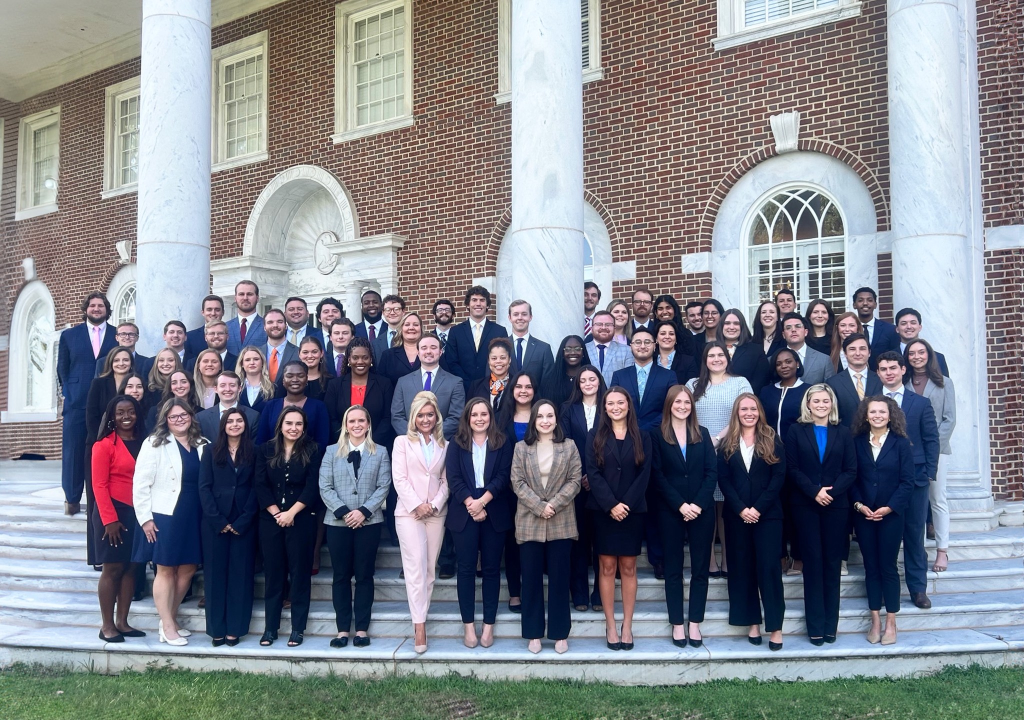 Students standing on the front porch of Mercer Law School