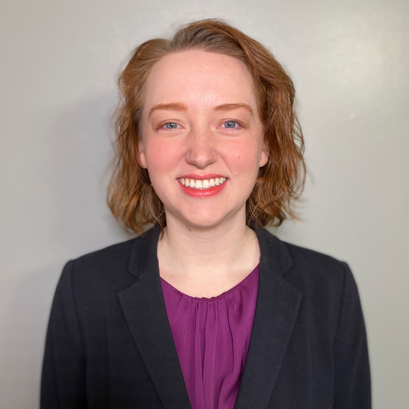 Woman in navy blazer.