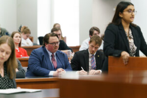 Caine and Bo Bagley sitting in a courtroom
