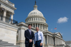 Trippe Moore stands next to Chairman of House Judiciary Committee Jim Jordan in front of the United States Capitol building in Washington, DC