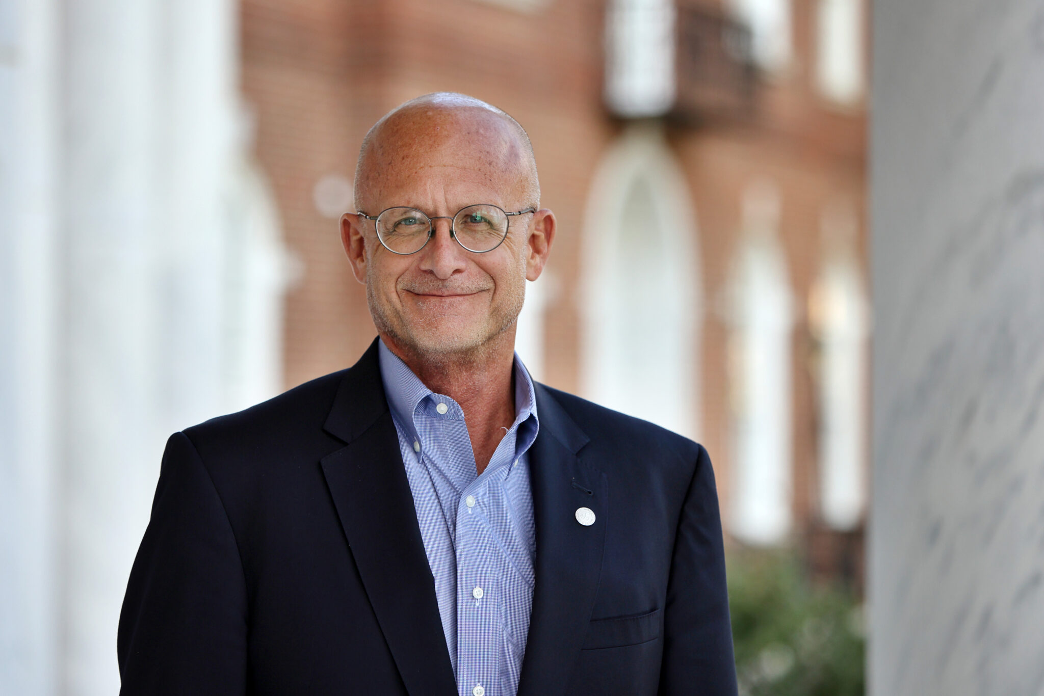 David Hricik stands on the front porch of the law school