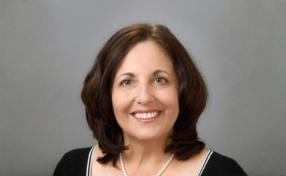Anne Johnson headshot in front of a gray background